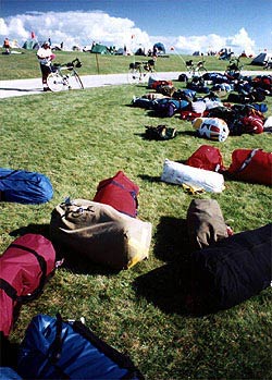Rows of duffel bags and tents are common on rides like DALMAC.