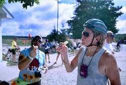 Cyclists enjoy cherries and other fresh fruit near Stoney Lake. Mich.