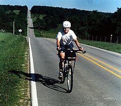 John Lewis climbs
            a hill on CAMP 1996.