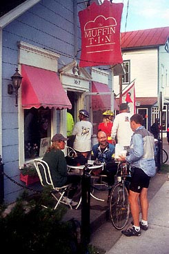 Cyclists wait outside the Muffin Tin in Alden to sample some of the shop's giant muffins. 