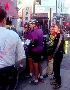 Cyclists wait outside the Muffin Tin in Alden to sample some of the shop's giant muffins. 