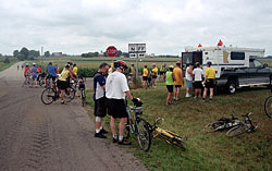Cyclists take a break
            for water at a SAG station stop southwest of Oshkosh. 