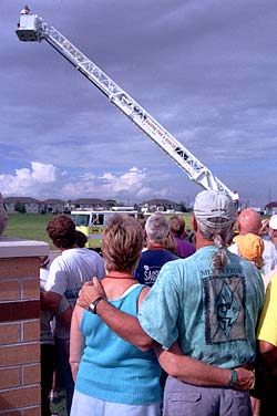 To honor our visit to
            Waupun, a photograph got up on a firetruck to get an aerial
            photo of the SAGBRAW riders. 