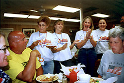 The waitresses at Smiley's barbecue restaurant in Lexington celebrated Bubba Barron's "birthday" during Day 1 of CNC. Bubba's new business, Bubba's Pampered Pedalers, was a big hit with cyclists. (Photograph by Doug Kaufman)